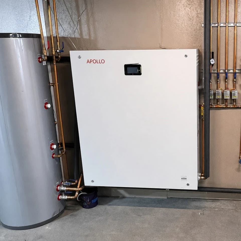 Installed APOLLO Hydro Station connected to a tank and copper hydronic piping