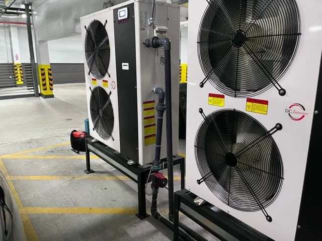 Two APOLLO air-to-water heat pumps installed in a modular commercial arrangement